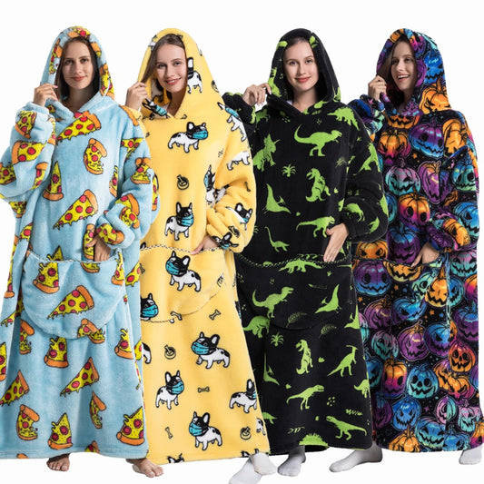 Four people wearing colorful hooded blankets with different patterns.