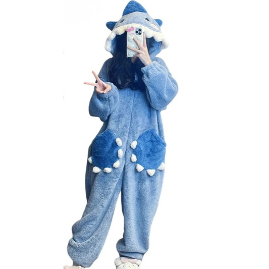 Person wearing a blue animal onesie with a hood on a white background