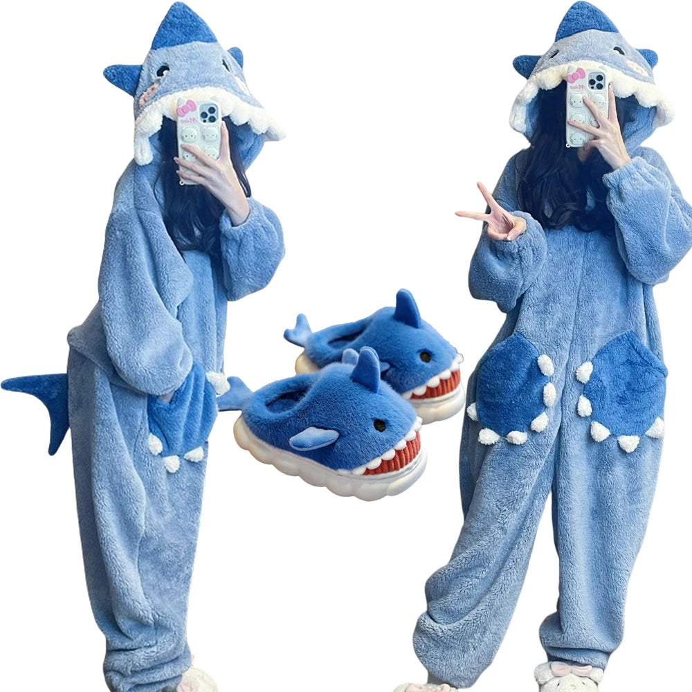 Person wearing a blue shark-themed onesie with matching shoes on a white background