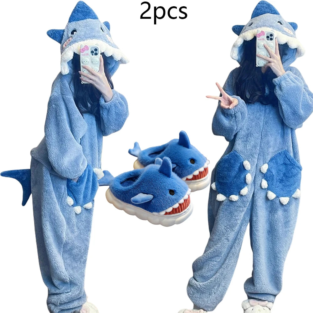 Person wearing a blue shark-themed onesie with matching shoes, holding a phone.