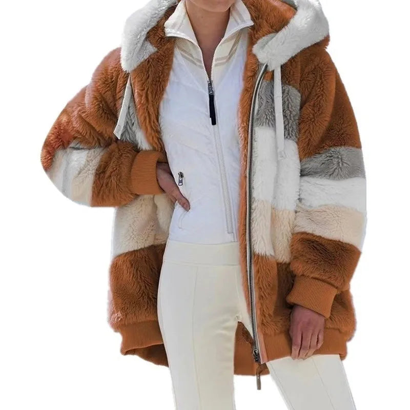 Person wearing a brown and white fur coat with a white shirt and pants on a white background
