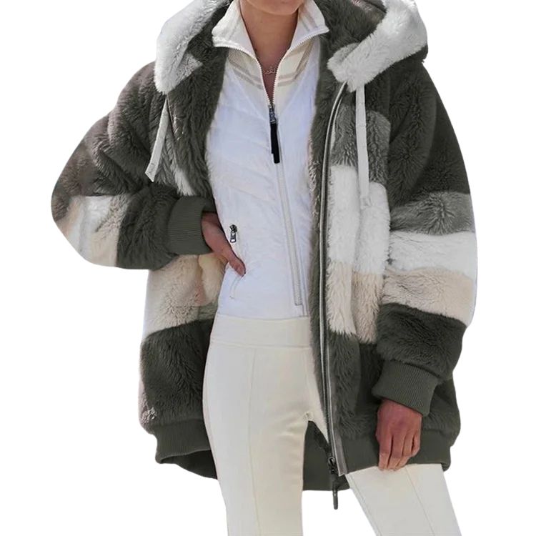 Person wearing a gray and white sherpa jacket on a white background