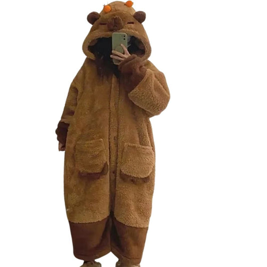 Person wearing a brown bear onesie on a white background