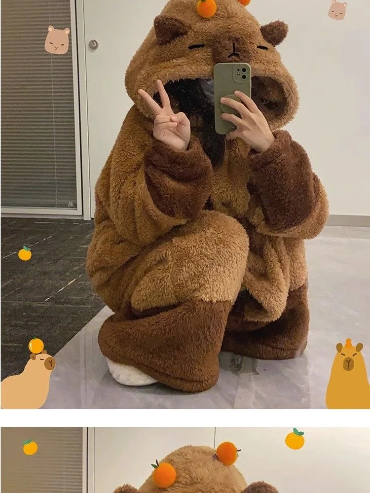 Person wearing a brown bear onesie taking a mirror selfie.