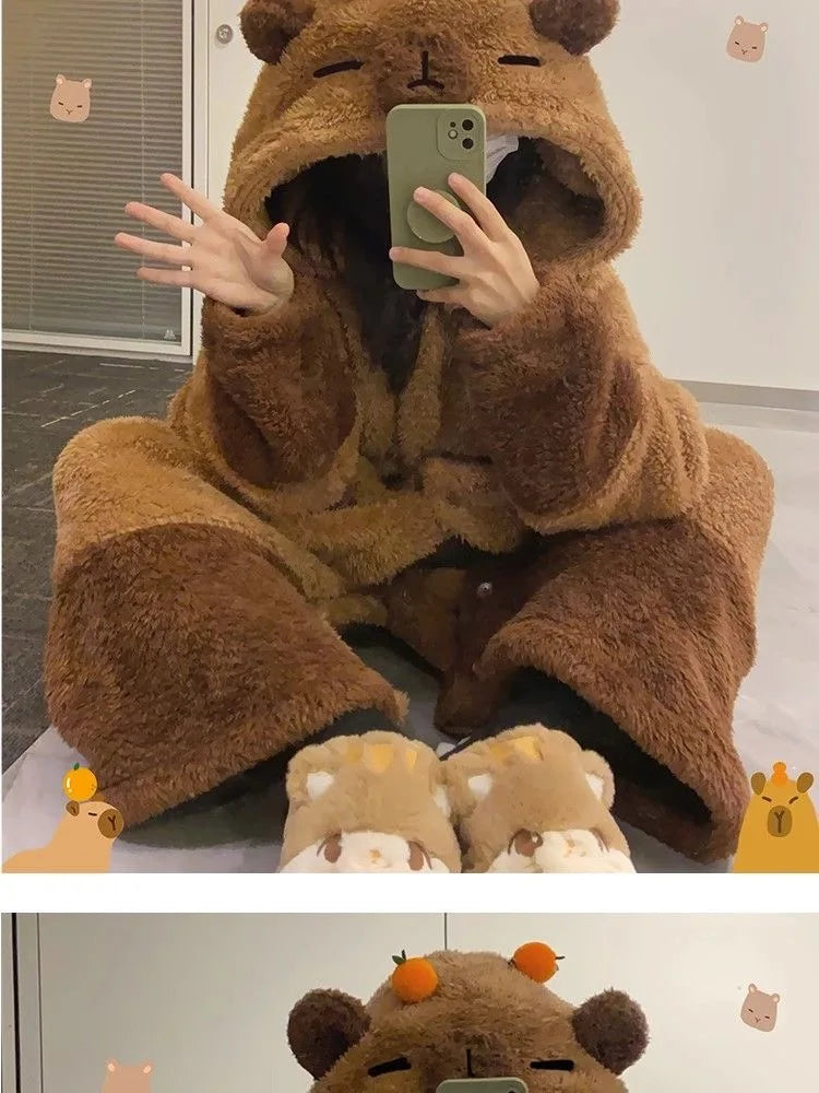 Person wearing a brown bear onesie taking a mirror selfie.