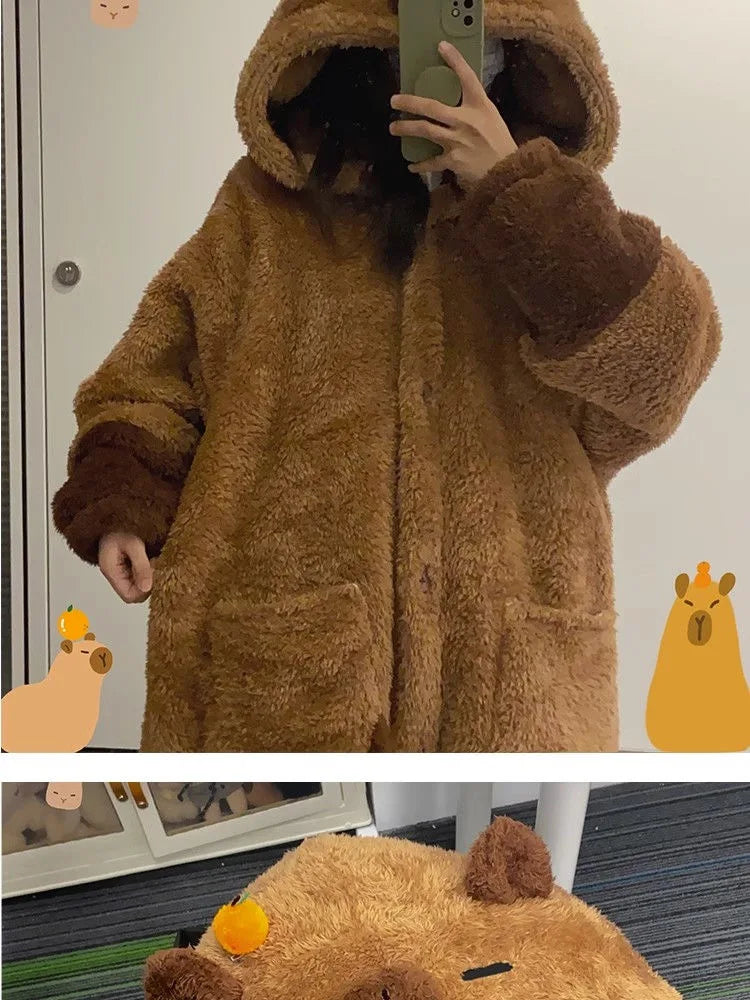 Person wearing a brown teddy bear coat with cartoon bear illustrations around.