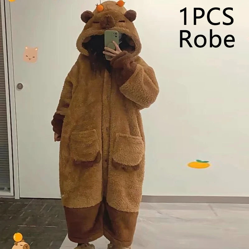 Person wearing a brown bear-themed robe taking a mirror selfie.