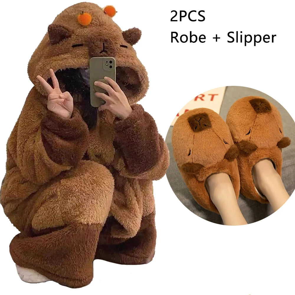 Brown bear-themed robe and slipper set with a person wearing them, holding a phone.