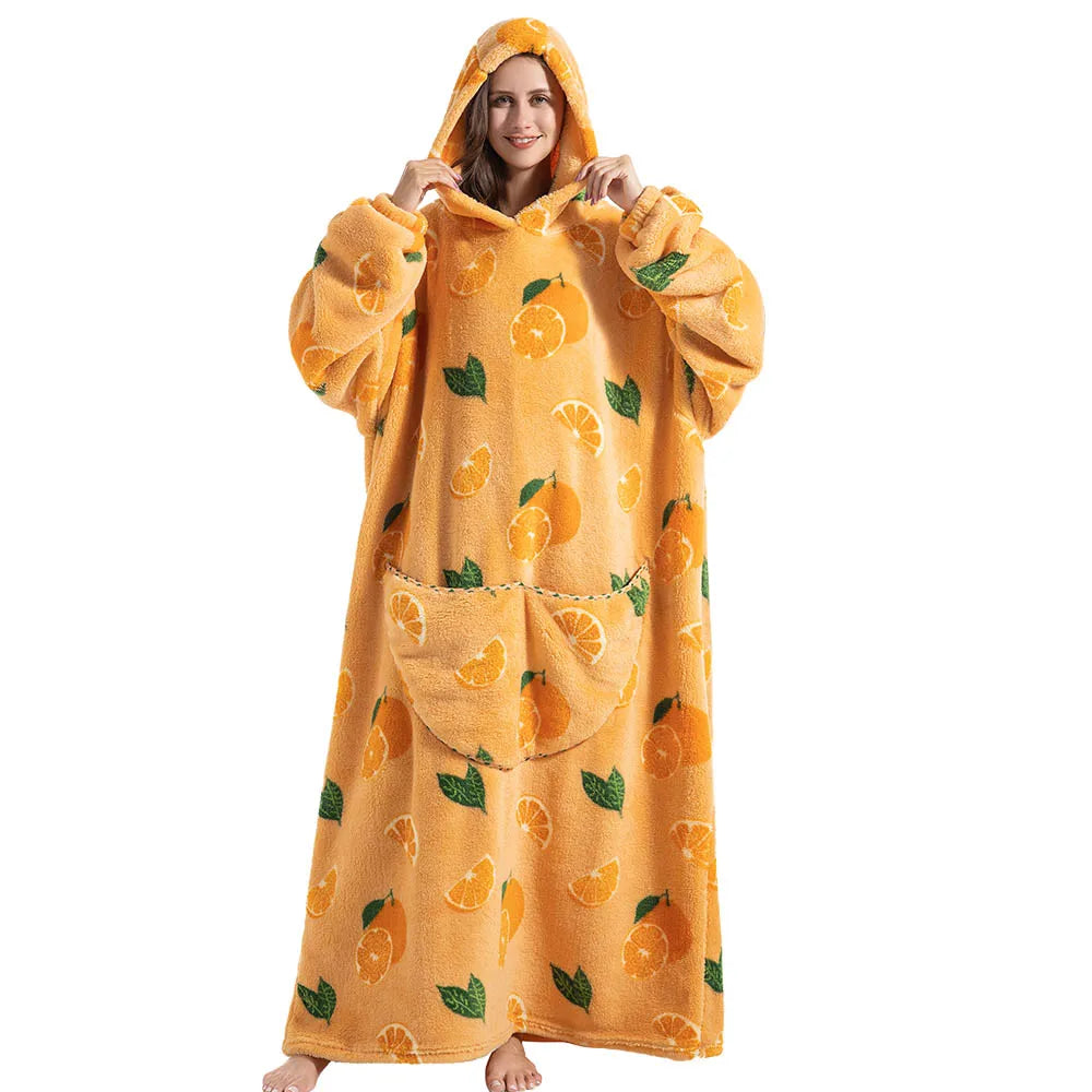 Person wearing a yellow hooded blanket with orange pattern on a white background