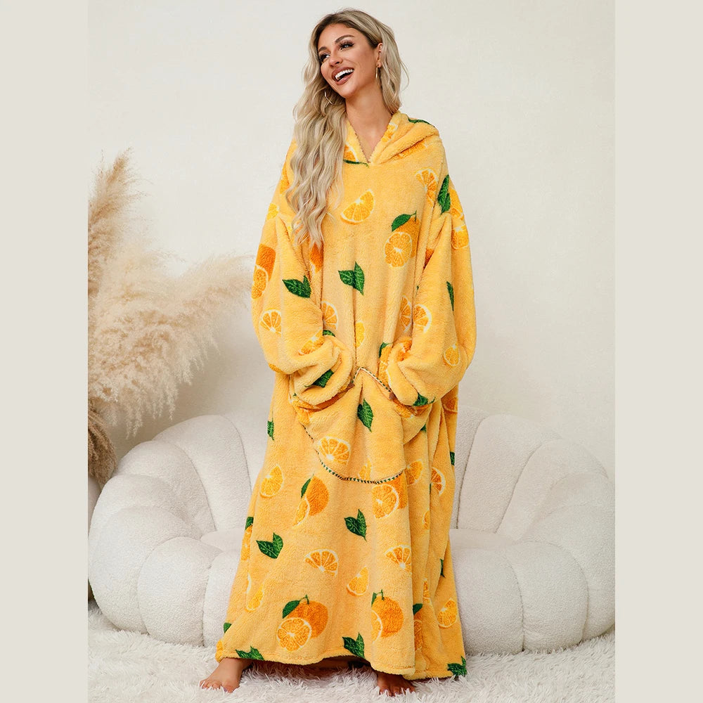 Woman wearing a yellow hoodie with orange patterns on a white background