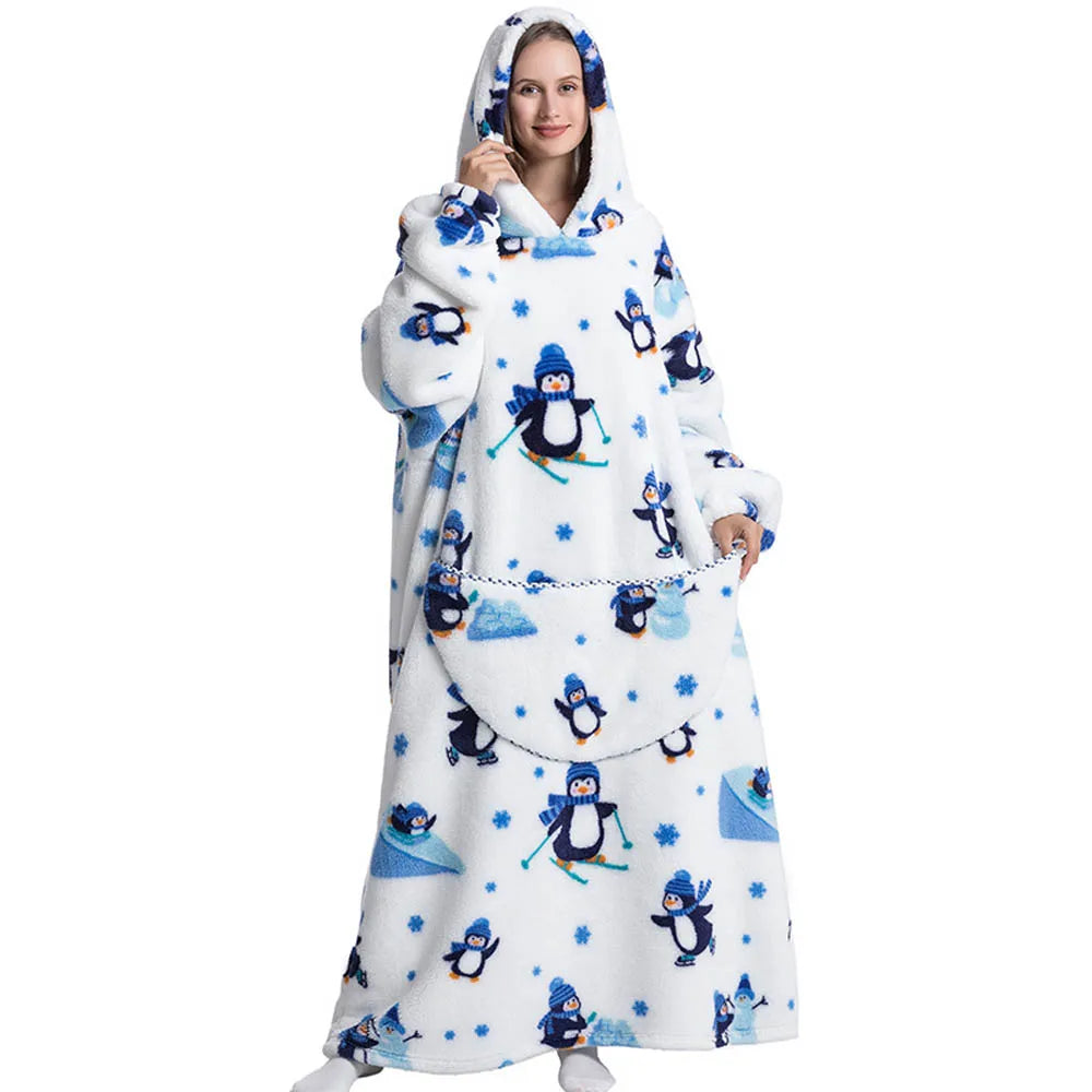 Person wearing a white fleece blanket with penguin design on a white background