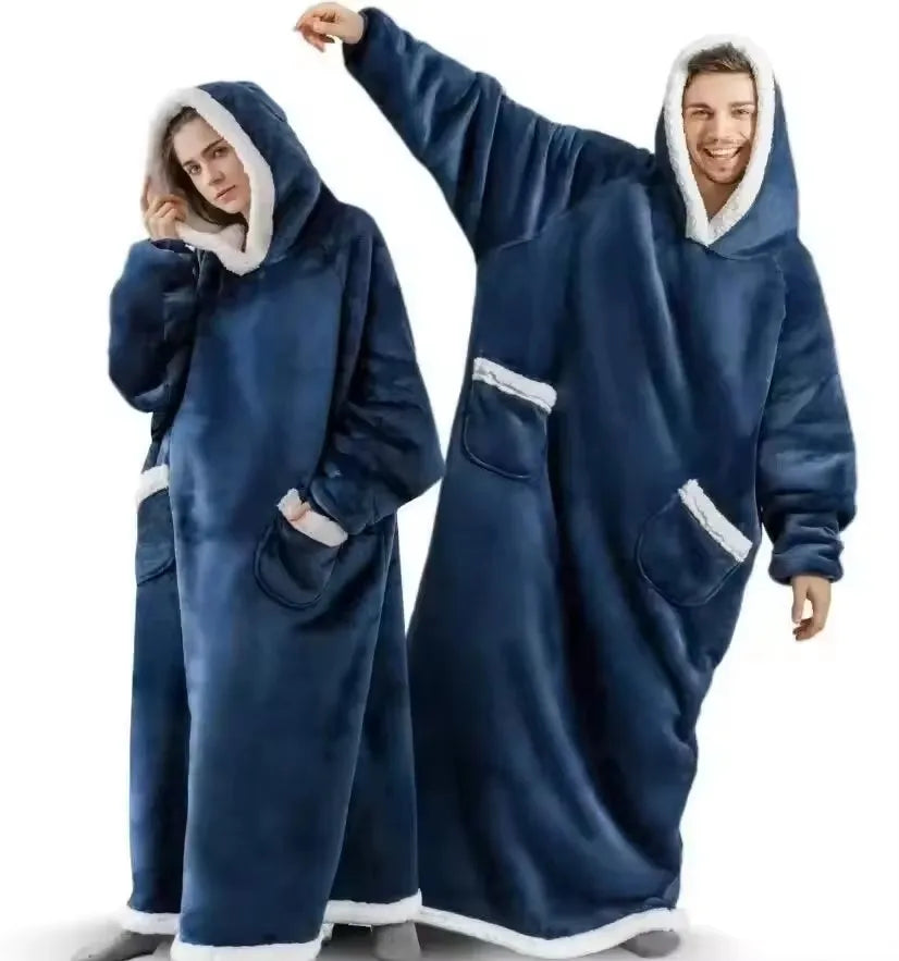 Two people wearing blue hooded blankets on a white background
