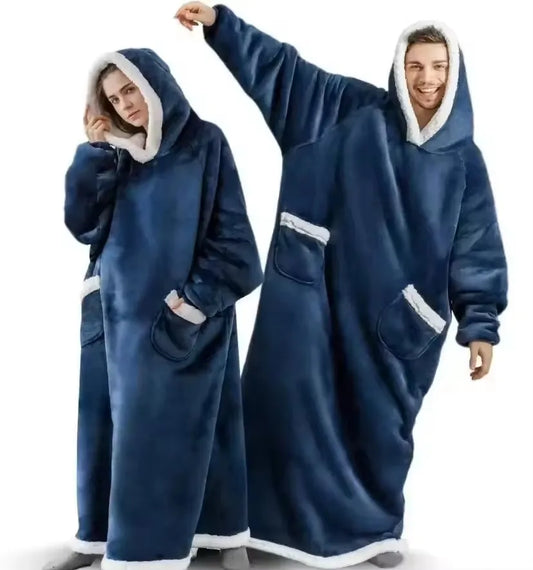 Two people wearing blue hooded blankets on a white background