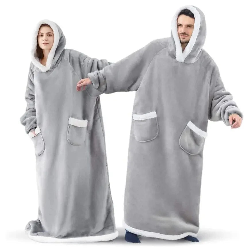 Two people wearing gray hooded robes with white trim on a white background