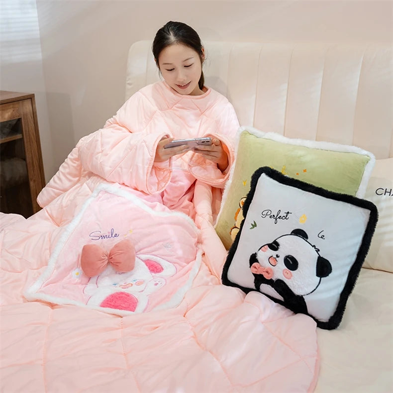 Person wrapped in a pink blanket with decorative pillows on a couch.