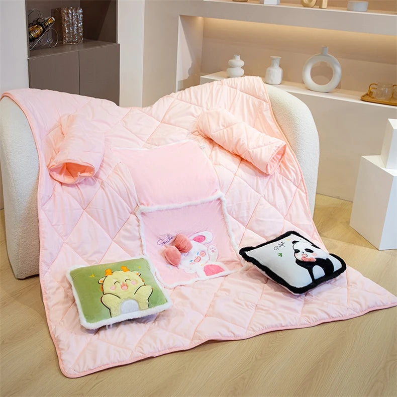 Pink quilt with cartoon character pillows on a chair in a room setting.
